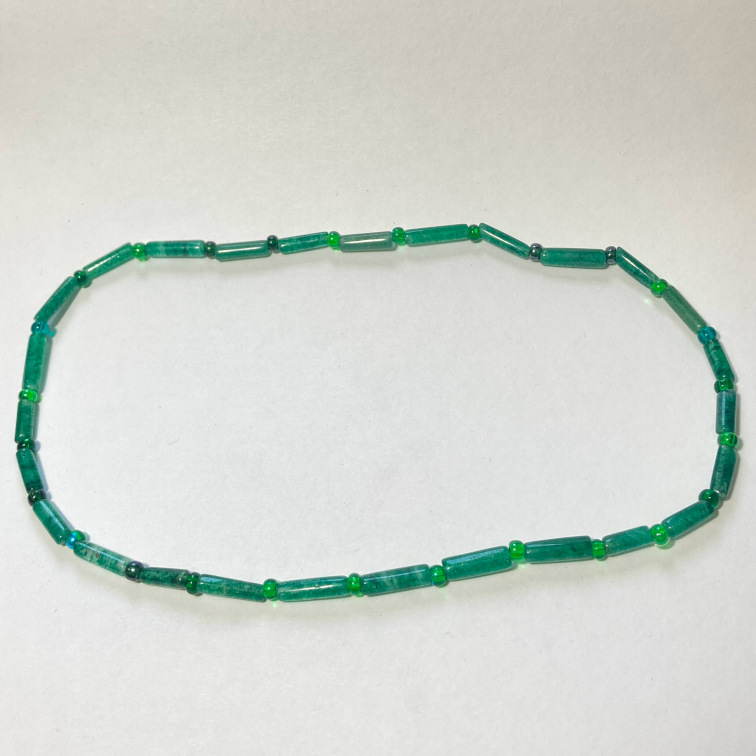 Simple aventurine tubes and beads, designed to fit snugly around the neck