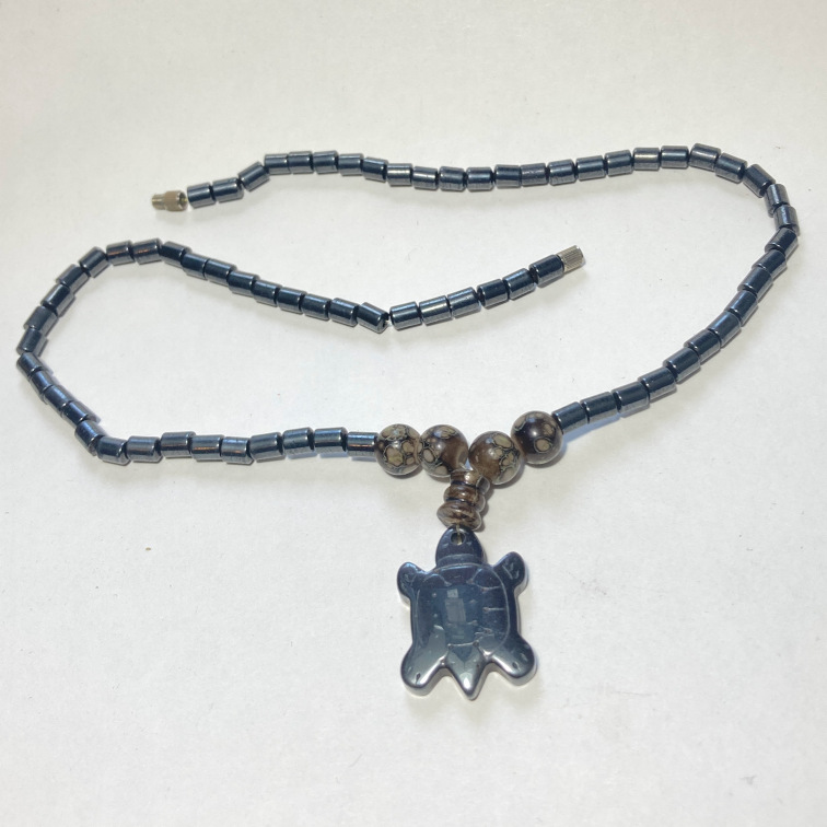 Hematite pendant in the shape of a turtle with simple hematite beads