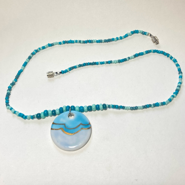 Eye-catching blue pendant with a variety of blue and turquoise beads
