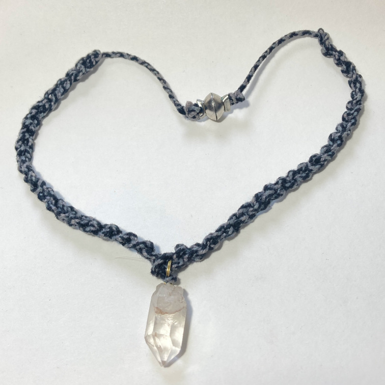 Simple quartz crystal on a braided decorative cord