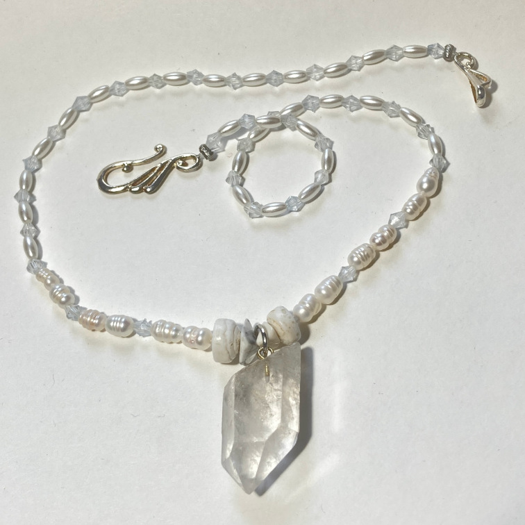 Quartz crystal with freshwater pearls and plastic accents