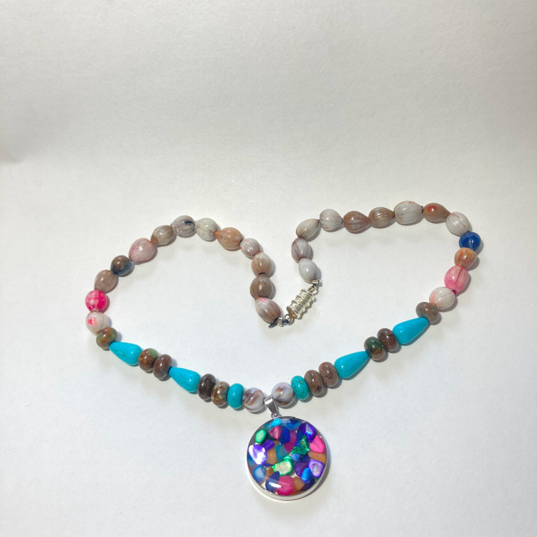 Glass pendant with dyed seeds, using turquoise and unakite beads